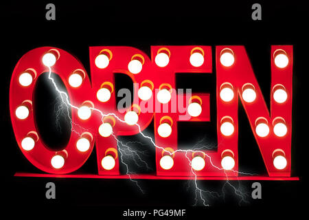 Luminous red color signboard Open decorated light bulbs with lightning effects on black background Stock Photo