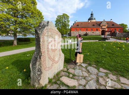 GRIPSHOLM CASTLE, SWEDEN ON MAY 11, 2018. View of the Runestone, entrance. Park, unidentified people and gate. Editorial use. Stock Photo