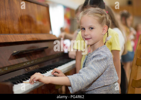 Belarus, Gomel, May 29, 2018. The kindergarten is central. Open Day.Child plays the piano.Preschool Music Education for Children Stock Photo