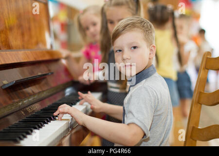 Belarus, Gomel, May 29, 2018. The kindergarten is central. Open Day.Child plays the piano.Preschool Music Education for Children Stock Photo