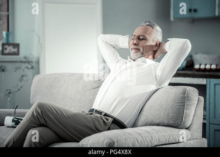 Pleased mature man having rest Stock Photo
