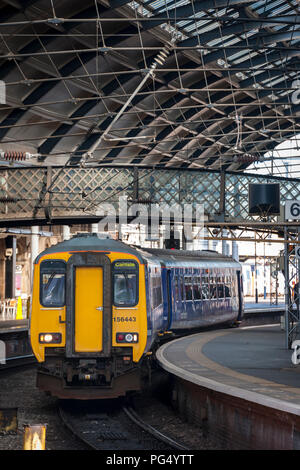 Northern Rail class 156 sprinter passenger train waiting at a station in Yorkshire, England. Stock Photo