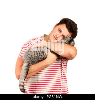 a guy holding a Scottish cat in his arms and feels caressing from him. emotional man isolated on white background. Stock Photo