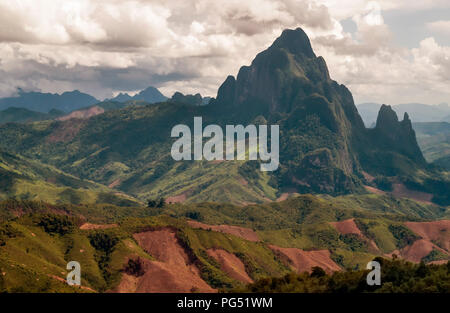 Panorama of central Laos with the highest mountains and a dramatic sky in the background Stock Photo