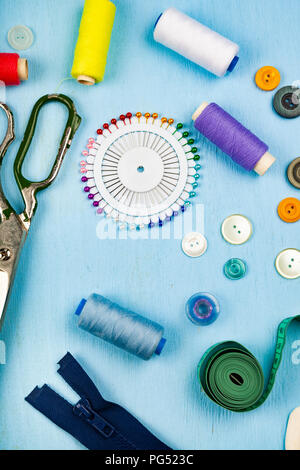 sewing buttons and zipper on white background Stock Photo - Alamy