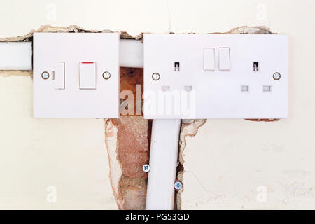 Closeup of a British electrical socket and switch during a domestic rewiring Stock Photo