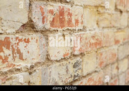 Detail of old brick wall, distressed and faded. Ideal for grunge background texture Stock Photo