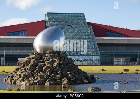 Keflavik International Airport near Reykjavik in Iceland. Abstract sculpture called The Jet Nest by Magnus Thomasson in front. Stock Photo