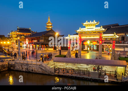 Wuxi, China - Apr 1, 2018: Tourists are enjoying the night view of the Nanchan Temple. Stock Photo