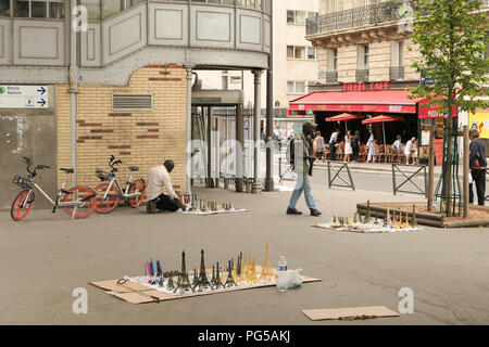 Eiffel tower souvenir street sellers, Paris, France Stock Photo