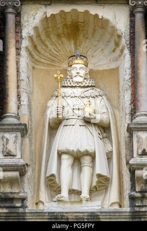 Statue of king James I (or VI) with orb and scepter on the west tower at Trinity college, Cambridge University, England. Stock Photo