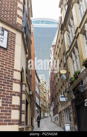 Looking up narrow Lovat Lane in the City of London with the Walkie Talkie building in the distance Stock Photo