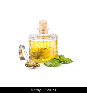 Glass bottle with extra virgin olive oil, canned green olive in spoon on a white background Stock Photo