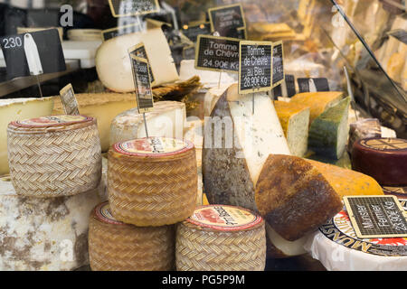 Cheese France market - Close up of semi-hard goat cheese sold at a farmers market in Paris, France, Europe. Stock Photo