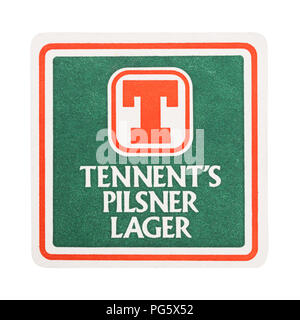 LONDON, UK - AUGUST 22, 2018: Tennent's pilsner lager vintage paper beer beermat coaster isolated on white background. Stock Photo
