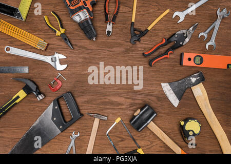 top view of arranged various tools on wooden table Stock Photo