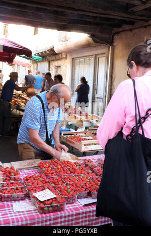 Fresh strawberries being sold at the Issigeac Sunday market in France 2018 Stock Photo