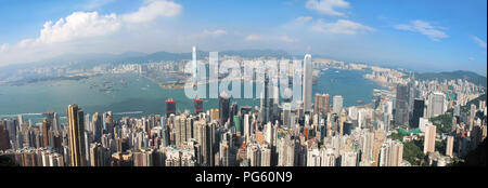 The world's most crowded city, Hong Kong city landscape, Victoria Harbor in between two lands full of buildings, a bit fish eye style city landscape Stock Photo