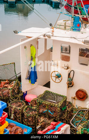 Hauls of crabs in boxes on a trawler Stock Photo