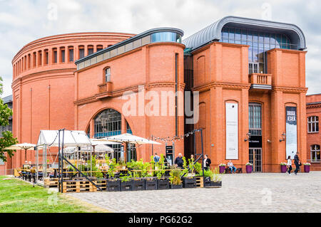 A massive red brick and glass building, part of the Stary Browar shopping centre in Poznań (Poznan), Poland Stock Photo