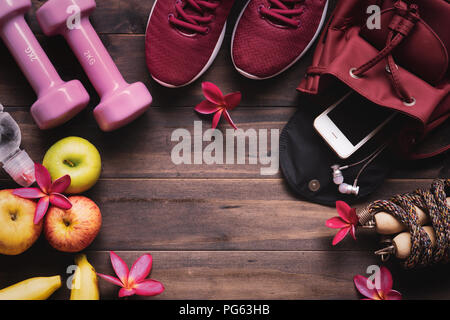 Woman active healthy lifestyle concept.  Weight and dieting concept. Creative flat lay of sport and fitness equipments  with woman accessories, apples Stock Photo