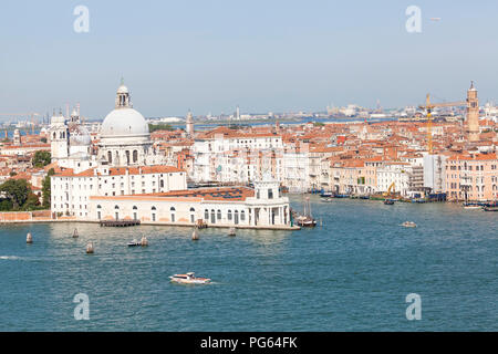 Aerial cityscape view of Punta della Dogana and Basilica di  Santa Maria della Salute, Venice, Veneto, Italy with a view over St Marks Basin to Marghe Stock Photo