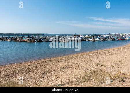 Fishing boats docked, moored in Poole Harbour, Dorset, UK Stock Photo