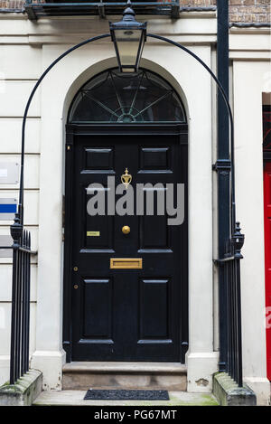 A Row of Brick Buildings with Black Doors on a Street in London Stock Image  - Image of architecture, english: 189002149