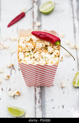 Box of popcorn flavoured with chili and lime Stock Photo