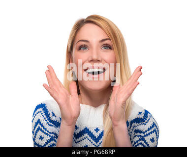 Woman in winter clothes expresses surprise. Isolated on isolated on white. Stock Photo