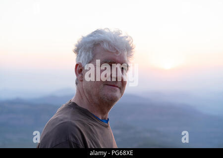 Spain, Catalonia, Man looking at sunset in the mountains Stock Photo