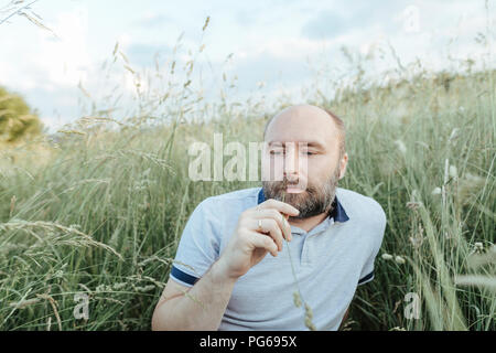 Portrait of mature man relaxing in nature Stock Photo