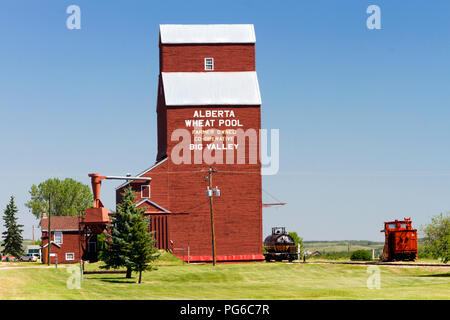 July 13, 2018 - Big Valley, Alberta, Canada: Old weathered wood grain elevators in the small Canadian prairie town of Big Valley, Alberta, Canada. Stock Photo