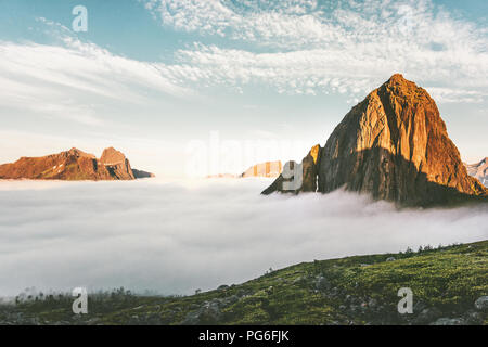 Mountains Landscape over clouds sunset peak view in Norway Travel scenery Stock Photo
