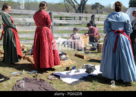 The Confederate Army camping during the American Civil War. Women around the camp. Historical reenactment at Appomattox, VA, USA. Stock Photo