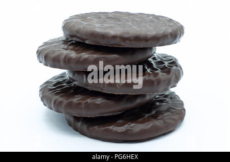Five chocolate ginger thin biscuits piled on top of each other with a white background and a good image foe a baker confectioner. Stock Photo