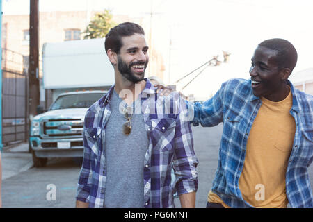 Two happy young men outdoors Stock Photo