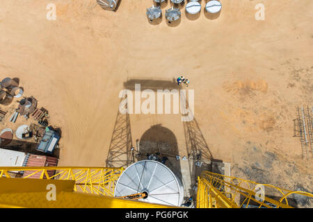 Ladder and tank on construction site from above Stock Photo