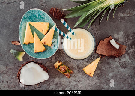 Fresh pineapple and coconut, juice in glass Stock Photo
