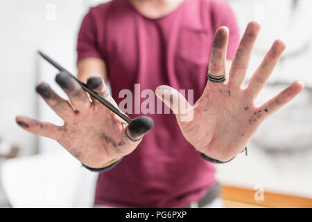 Artist showing his dirty hands Stock Photo