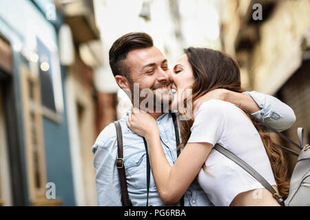 Affectionate happy tourist couple exploring the city Stock Photo