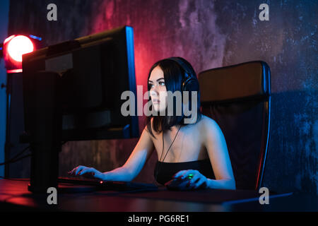 Portrait of a worried woman using a PC in the night at home. Stock Photo