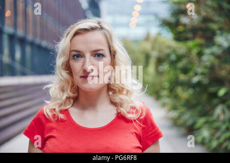 Portrait of blond woman outdoors Stock Photo