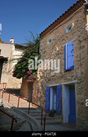 Beautiful traditional houses, Rue de la Tour, Gruissan village, Aude, Occitanie, France Stock Photo