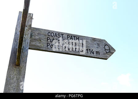 A wooden footpath finger post saying Coast Path , public footpath to Porthgwarra 1 1/4 miles, Cornwall, England A wooden footpath finger post saying Coast Path , public footpath to Porthgwarra 1 1/4 miles, Cornwall, England