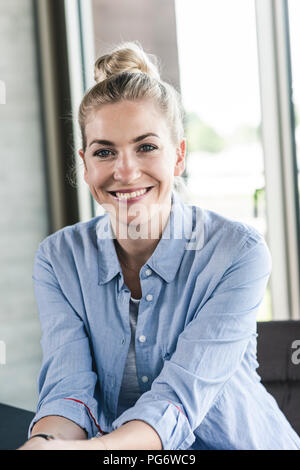 Portrait of a smiling young businesswoman Stock Photo