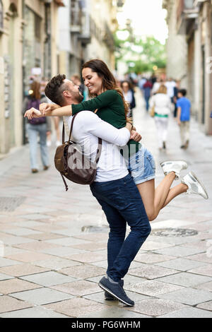 Affectionate happy tourist couple having fun in the city Stock Photo