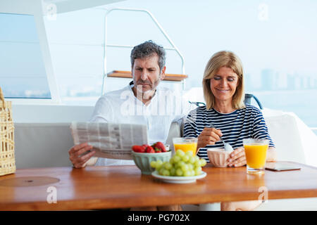 Couple on a sailing trip having a healthy breakfast Stock Photo