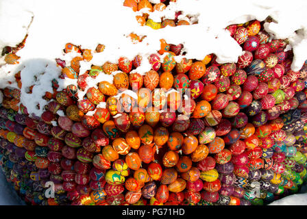 Easter eggs forming a shape on snow Stock Photo
