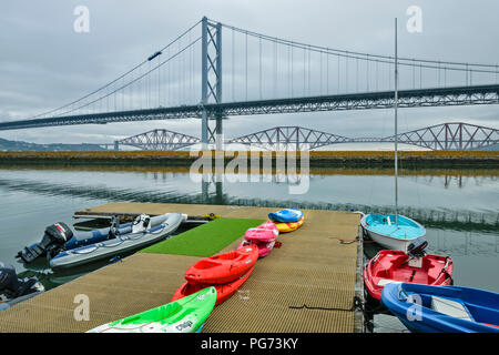 PORT EDGAR MARINA WITH KAYAKS BOATS AND THE OLD ROAD BRIDGE AND RAILWAY BRIDGE Stock Photo